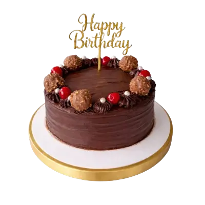Decadent chocolate birthday cake featuring a gold 'Happy Birthday' topper, gourmet hazelnut chocolates, and cherry decorations."